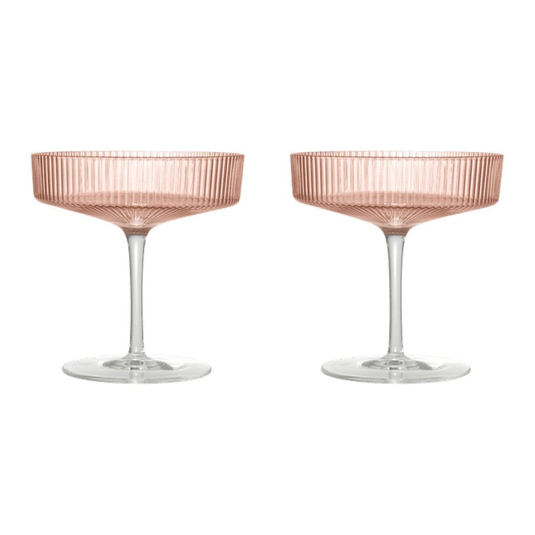 Rose gold champagne coupes with a delicate ribbed pattern and clear glass stems. Perfect for elegant celebrations.