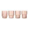 Set of four glass vases in soft rose color with vertical ribbed texture. Elegant and modern design.