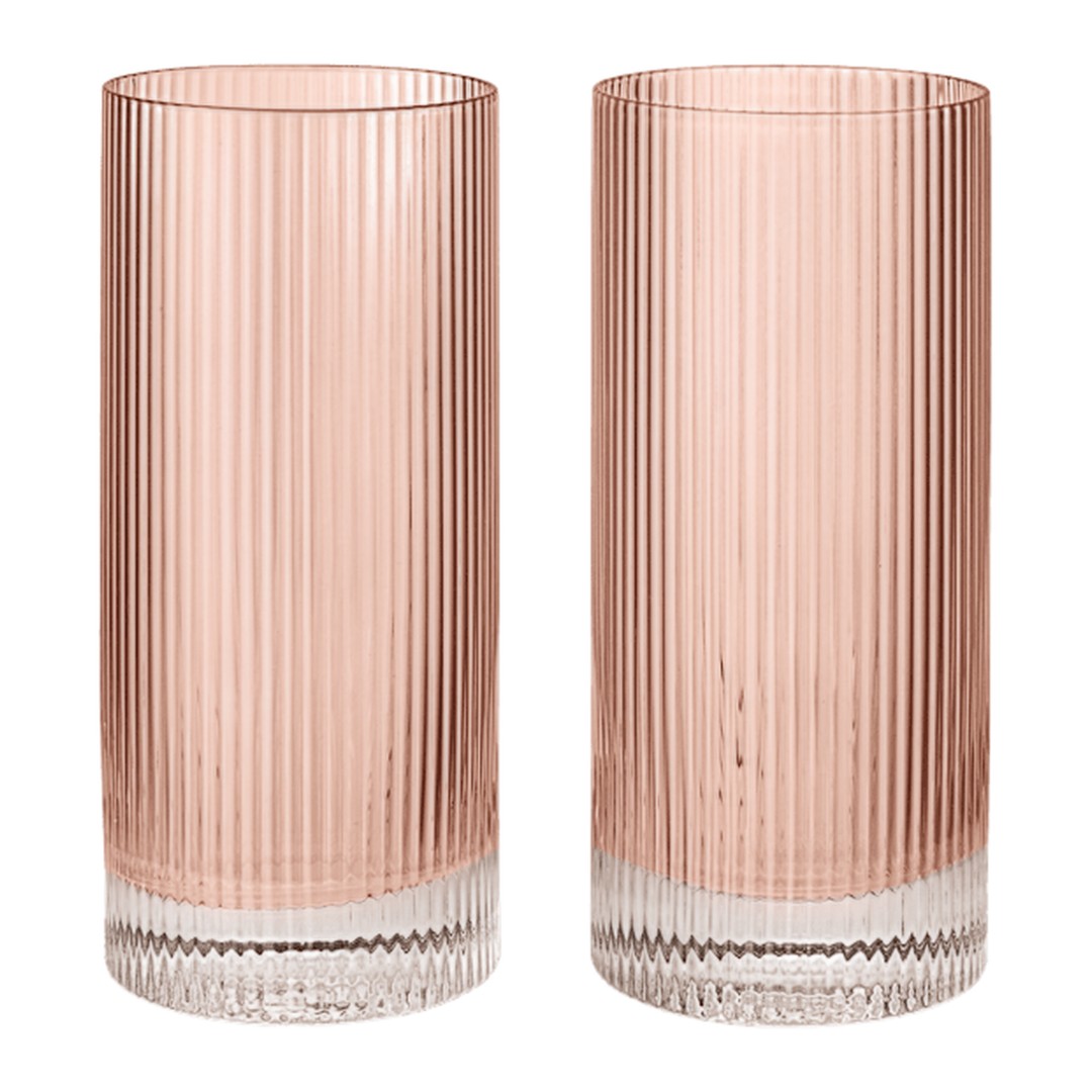 Set of two ribbed glass tumblers in soft pink with clear bases, showcasing a modern and elegant design.