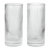 Clear glass tumblers with elegant vertical ribbed texture, perfect for modern table settings.
