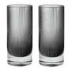 Set of two tall, clear glasses with a sleek ribbed pattern and gradient from transparent to black.