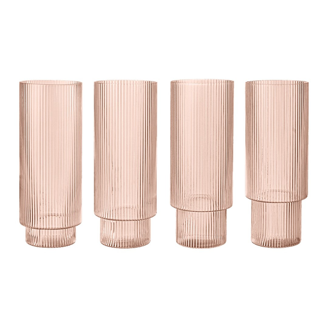Set of four ribbed blush pink glass vases with a sleek, modern design and a soft, translucent finish.