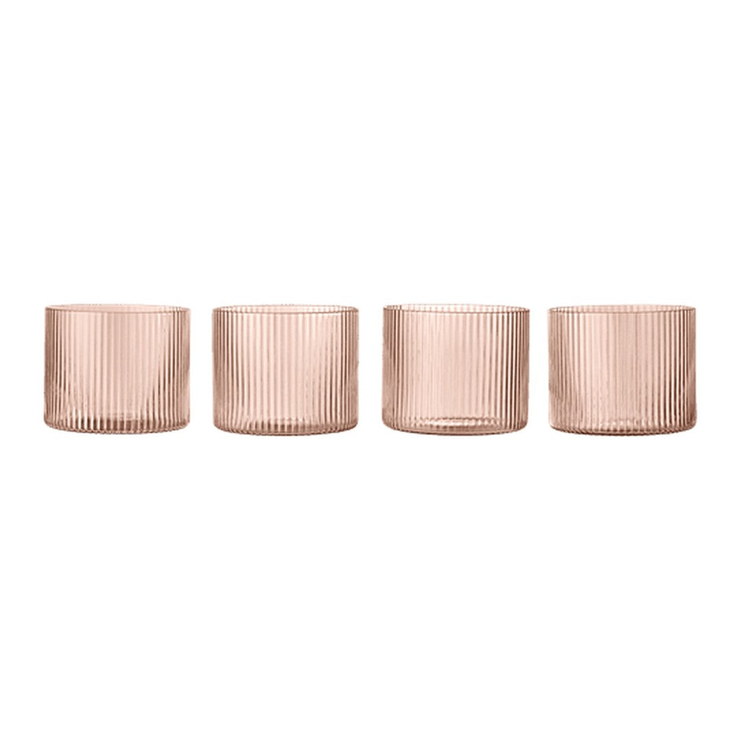 Set of four rose gold ribbed planters with a sleek, modern design. Perfect for contemporary home decor accents.