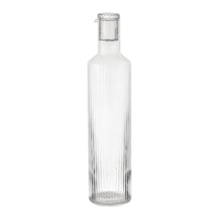 Clear glass water bottle with vertical ribbed pattern, featuring a sleek, modern design. Perfect for any decor.