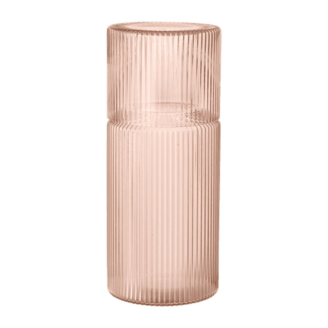 Textured glass vase in soft blush pink with vertical ribbed pattern, perfect for home decor accents.