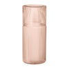 Textured glass vase in soft blush pink with vertical ribbed pattern, perfect for home decor accents.