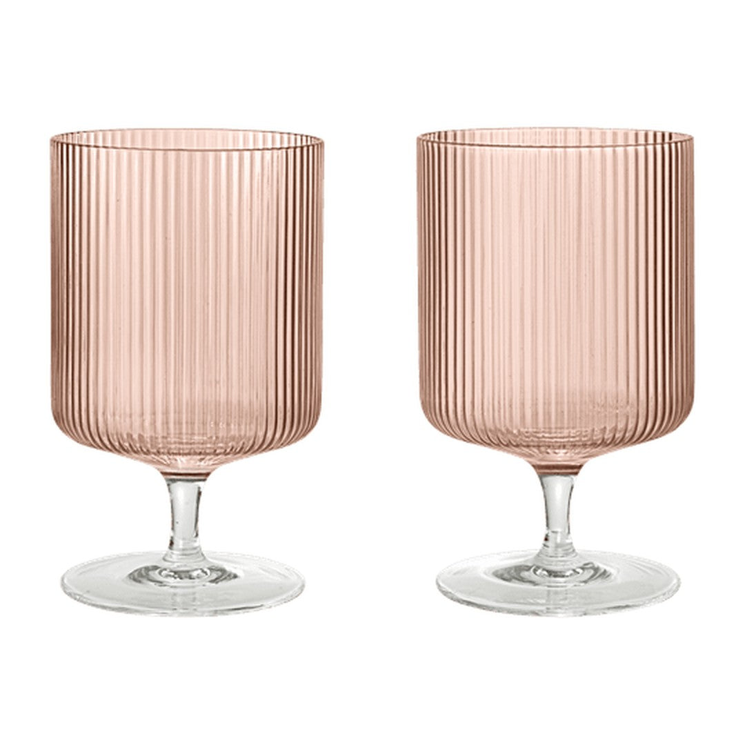 Set of two ribbed glass goblets in soft pink with transparent bases, perfect for stylish dining.