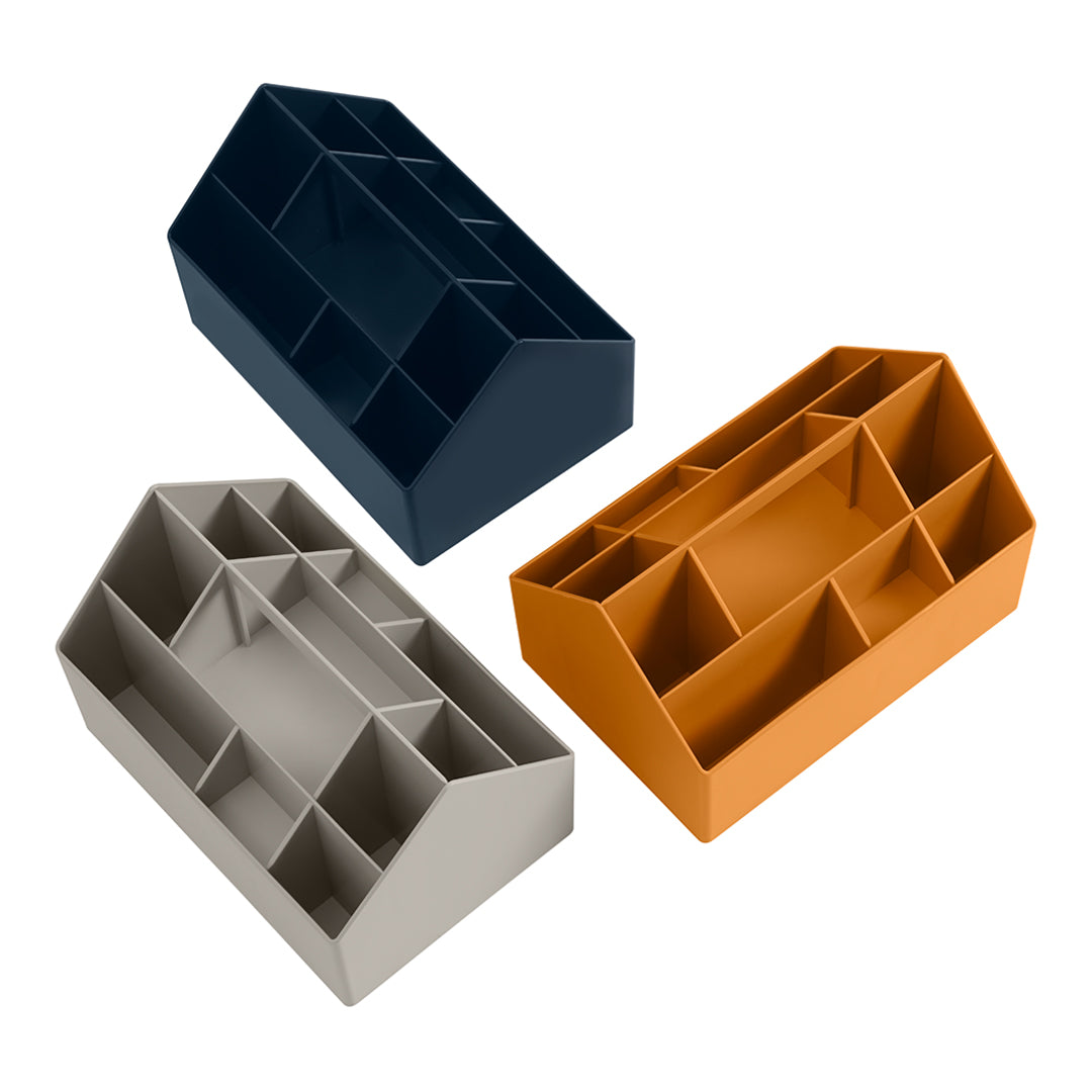 Three organizational trays in navy blue, gray, and vibrant orange, featuring a modern geometric design and multiple compartments.